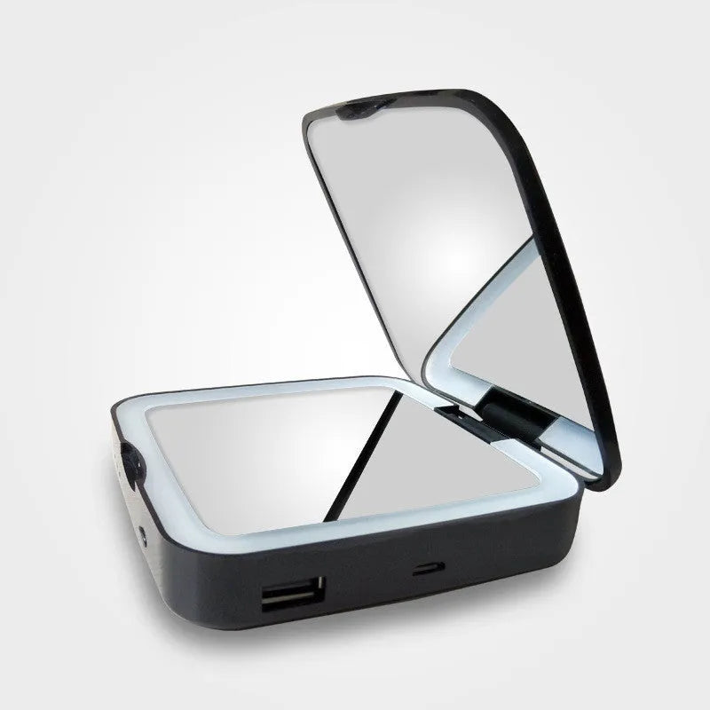 Black and white lighted makeup mirror showing dual HD and 4x magnification panels with adjustable LED lighting.