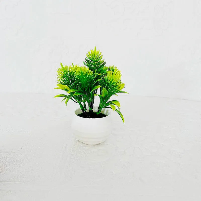 Simulated bonsai potting ornament in green plastic with bonsai shape on white background