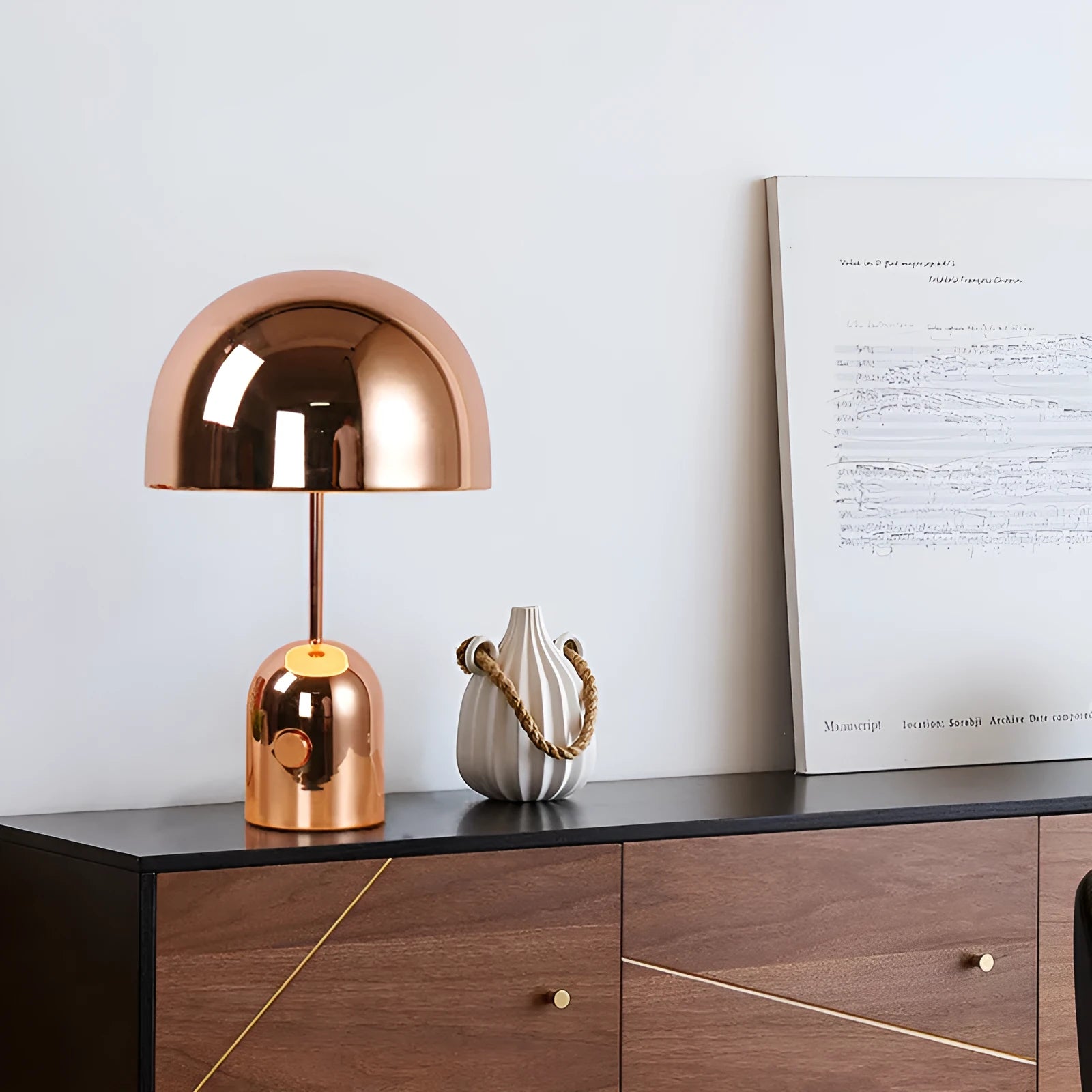 Post-modern metal table lamp with 280mm diameter in rose gold finish on wooden surface