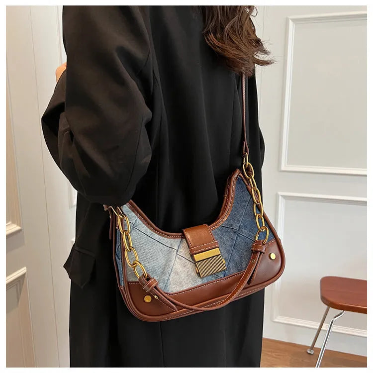Brown denim bucket shoulder bag with diamond mesh panels and metallic chain strap