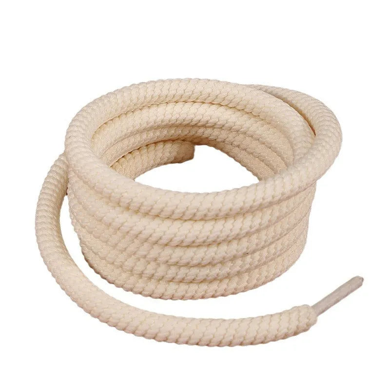 Solid colour round woven shoelaces for bread shoes in white, beige, and black.