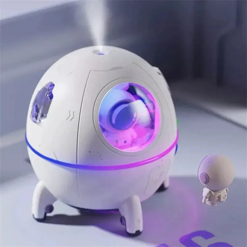 Astronaut-shaped portable USB humidifier with colourful LED light on a desk