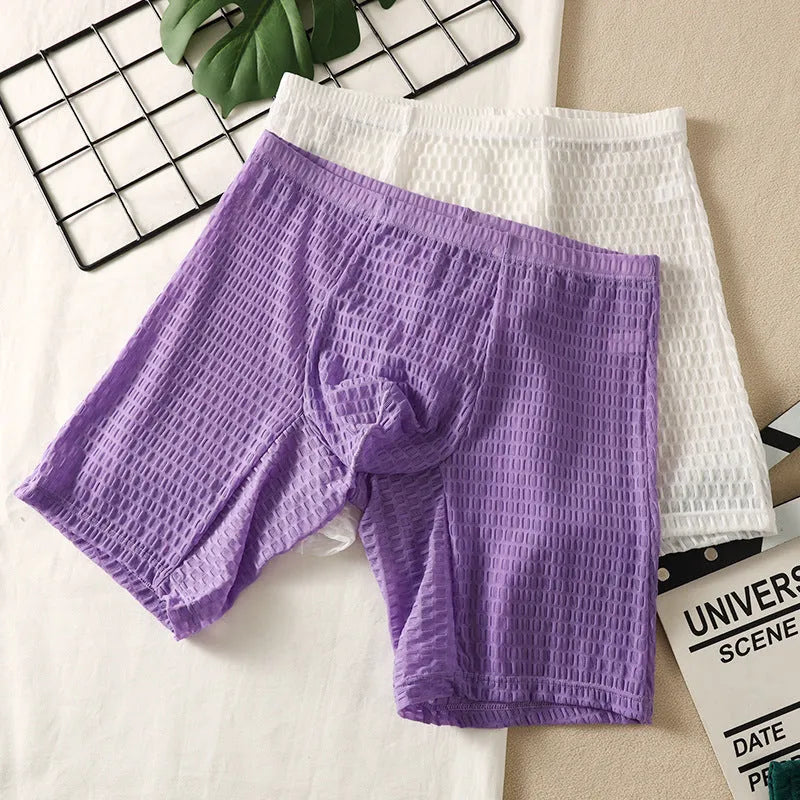 Men's white lace boxer shorts with lengthened cut and shaping function on mannequin