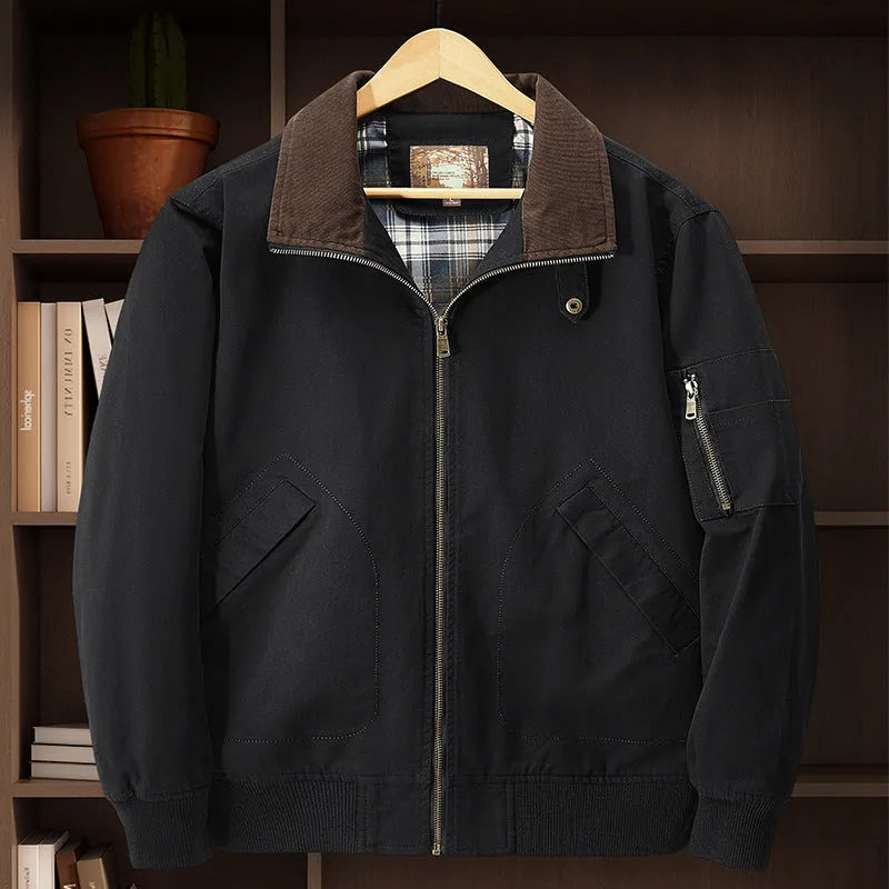 Men's camel coloured washed cotton baseball-style flight jacket on a hanger