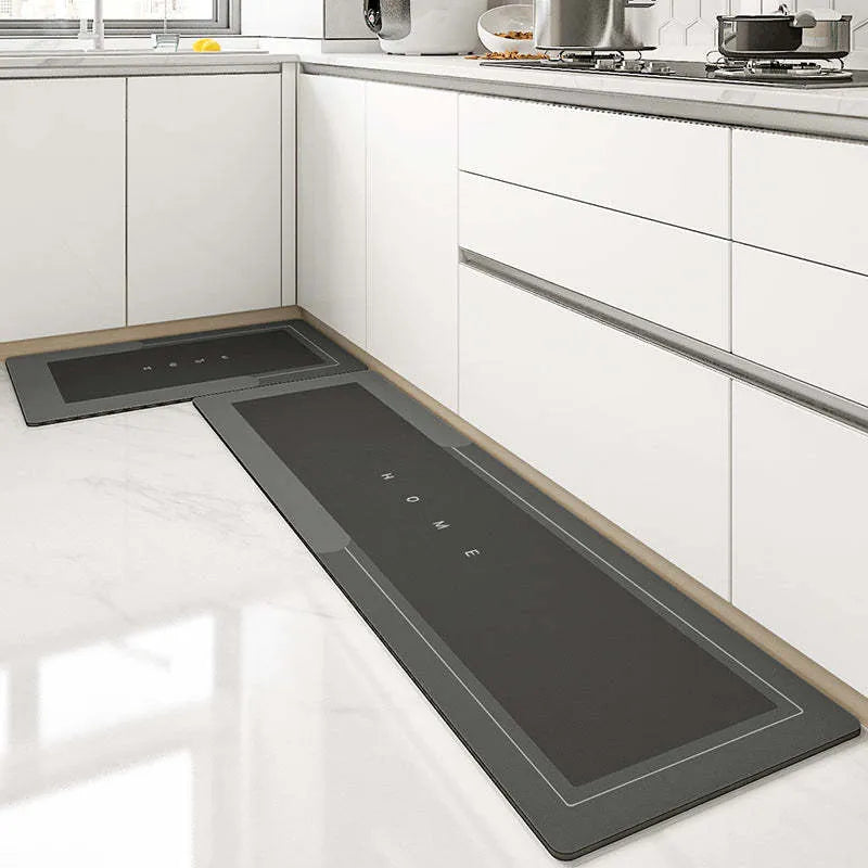 Blue oval blended bathroom floor mat on tiled floor next to a bath.