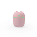 Round desktop humidifier with USB cable in ivory white colour showing mist output
