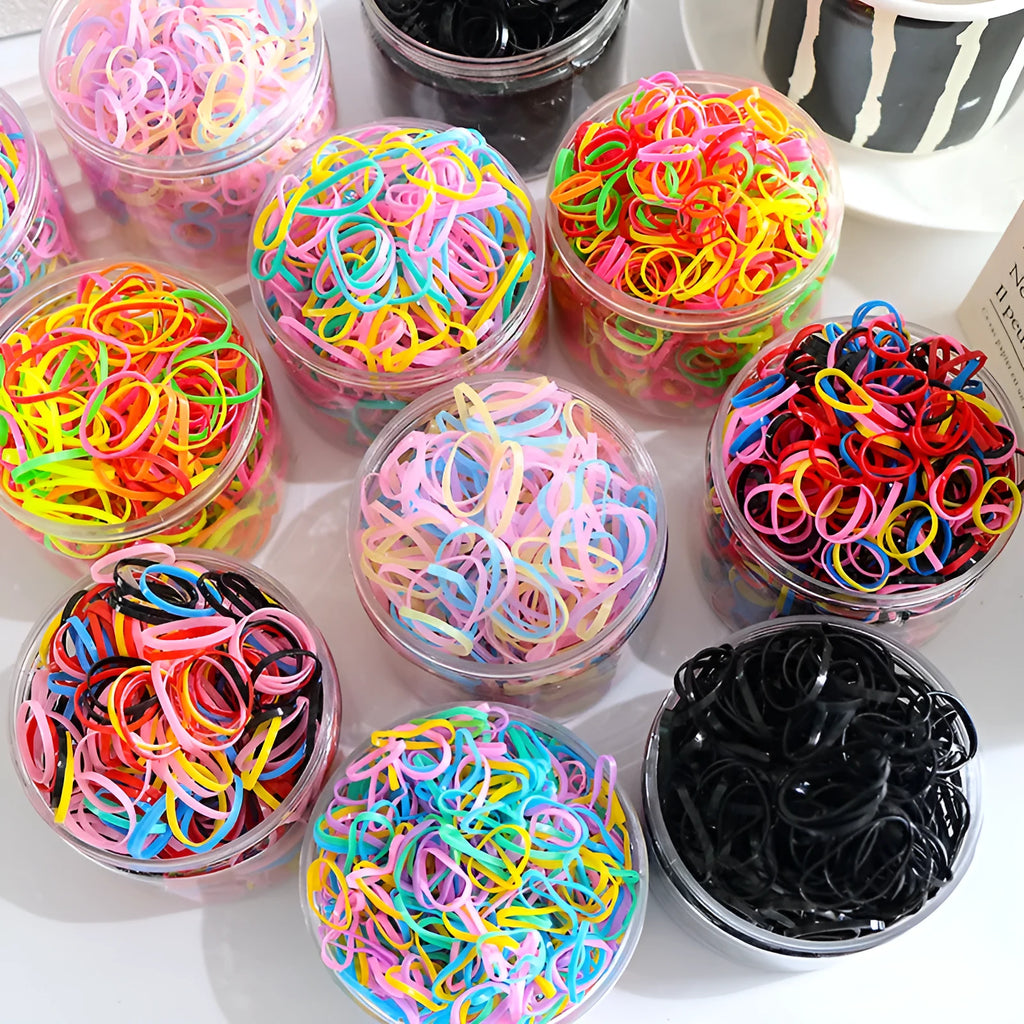 TPU baby hair ties in multiple colours stored in reusable container