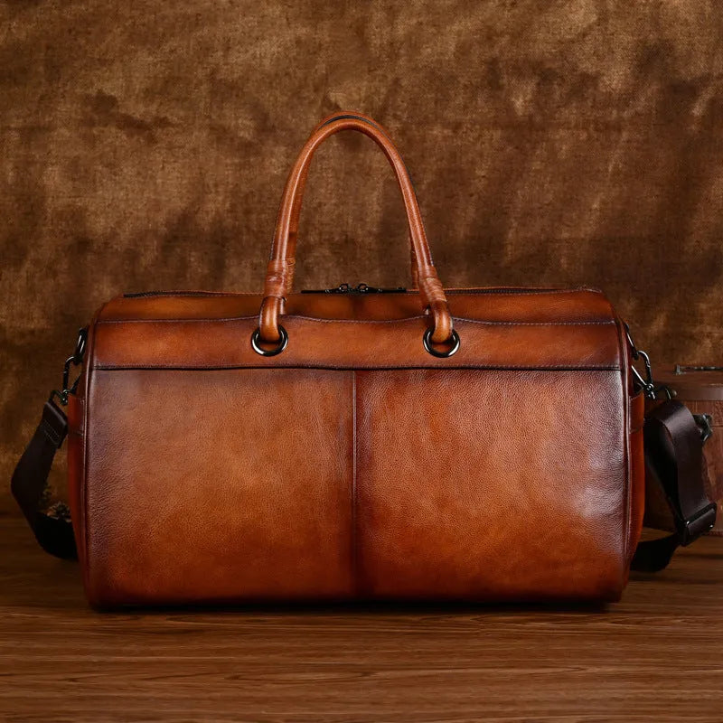 Handmade retro style leather bag in vintage brown colour showing first layer cowhide texture and large capacity design