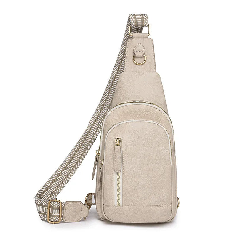 Women's soft brown PU leather crossbody chest bag with open pocket and adjustable strap.