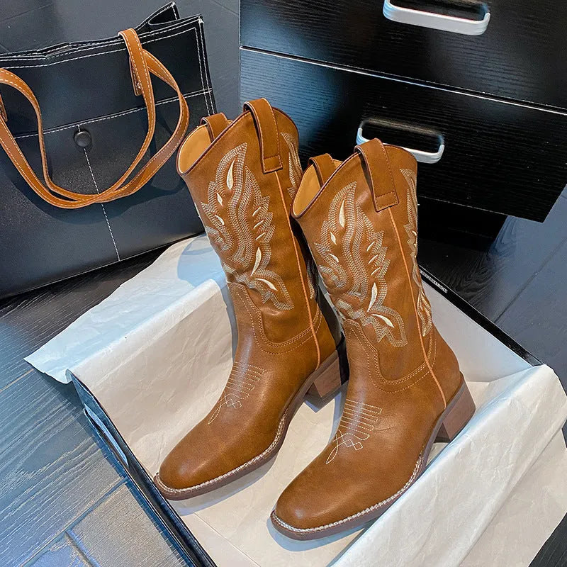 Brown embroidered women's mid-calf Martin boots with leather lining and a low square heel.