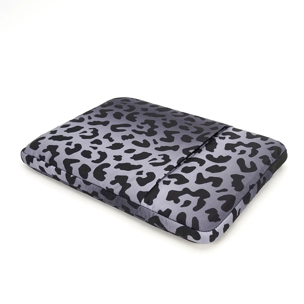 Leopard print flannel lined laptop sleeve for 13-inch to 16-inch devices with waterproof polyester exterior.