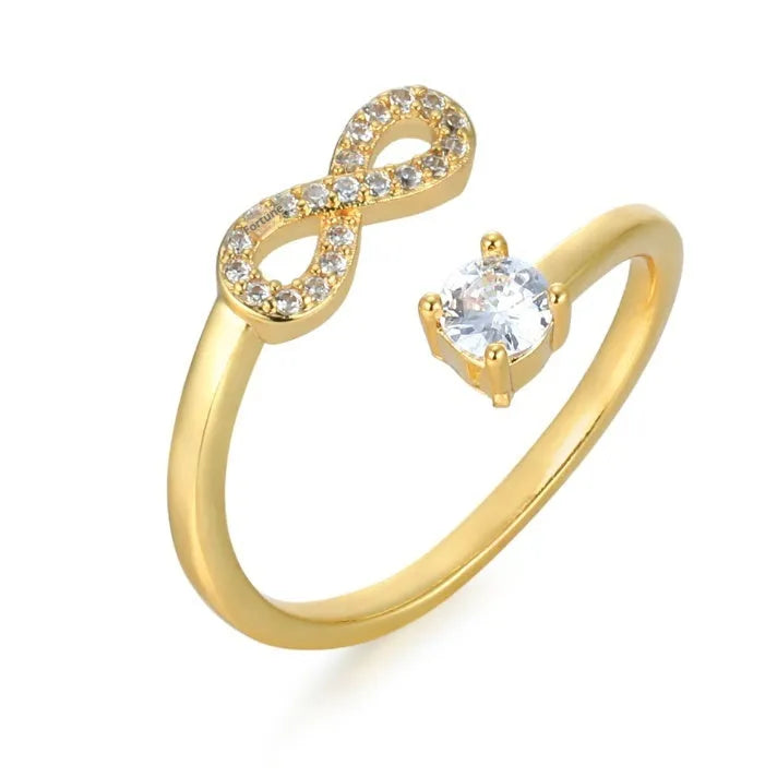 Personalised open geometric zircon letter ring in gold, rose gold, or silver tone metal.
