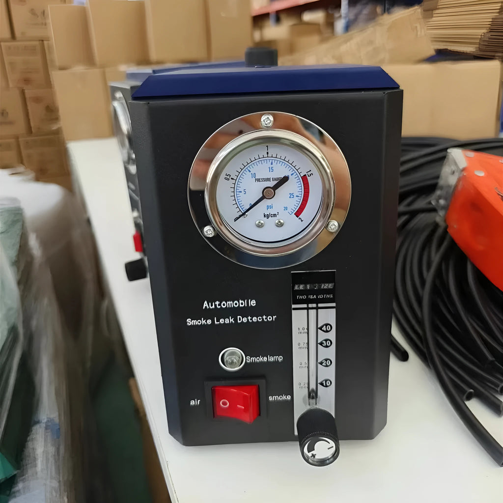 KT9105 English specification steel car smoke leak detector on a workshop bench.