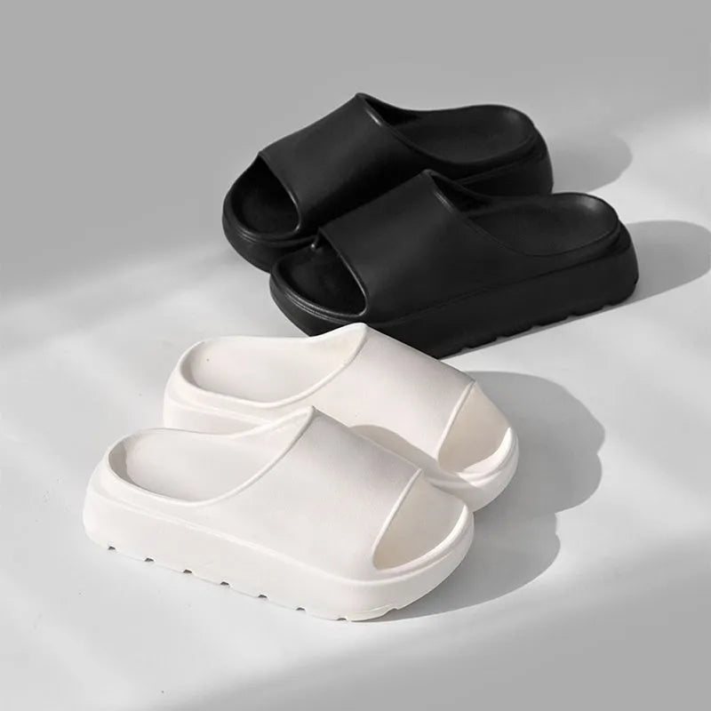Women's beige thick-soled EVA slippers with a 5.5cm platform, shown from the side.