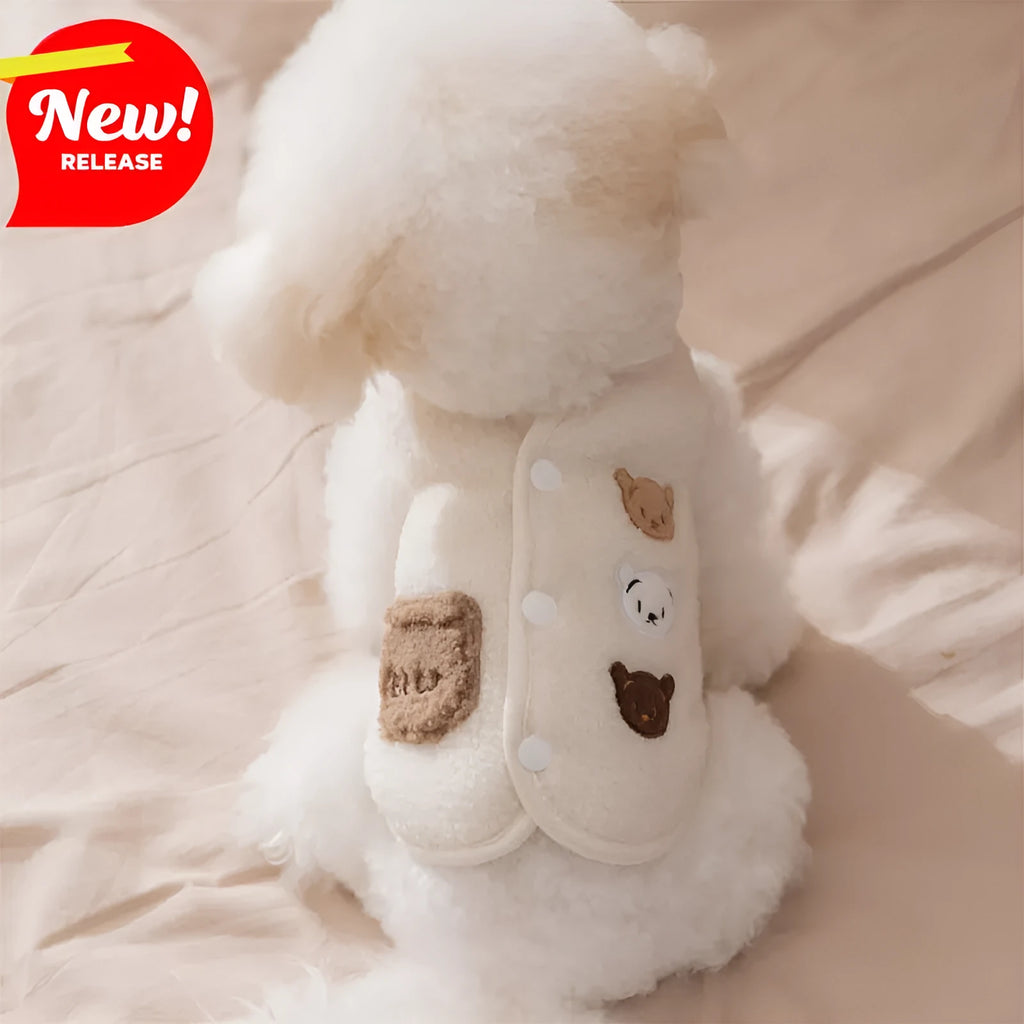 Brown fleece dog coat with bear embroidery and side-button closure on a small dog