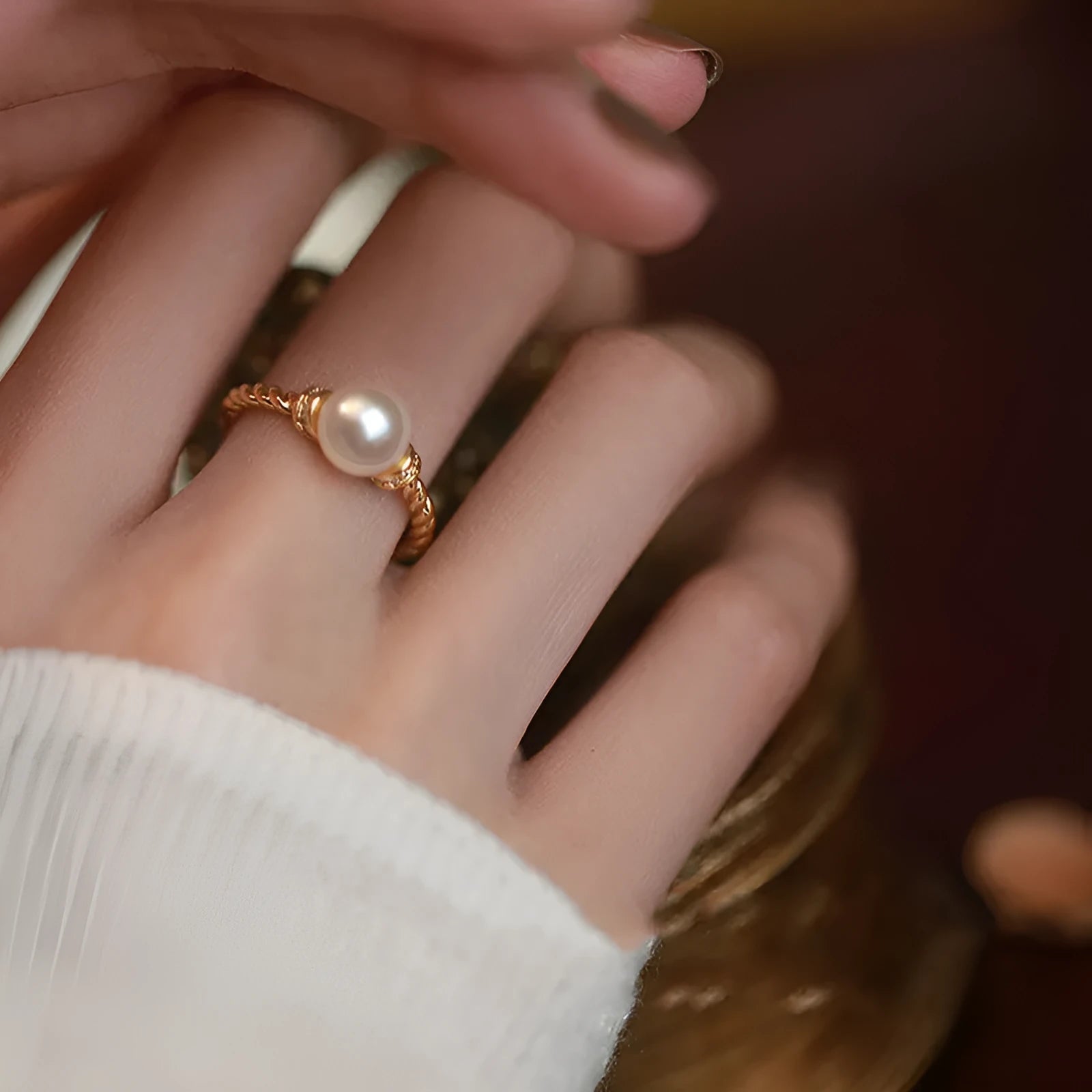 Geometric twist pearl ring with adjustable copper construction in gold colour