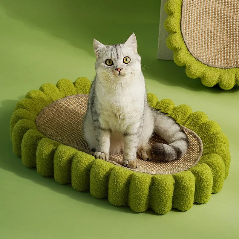 Green oval sisal cat scratch pad bowl serving as a cat bed and furniture protector.