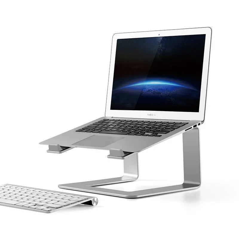 Black aluminium alloy laptop stand on a desk, showing its wide base plate and elevated height.