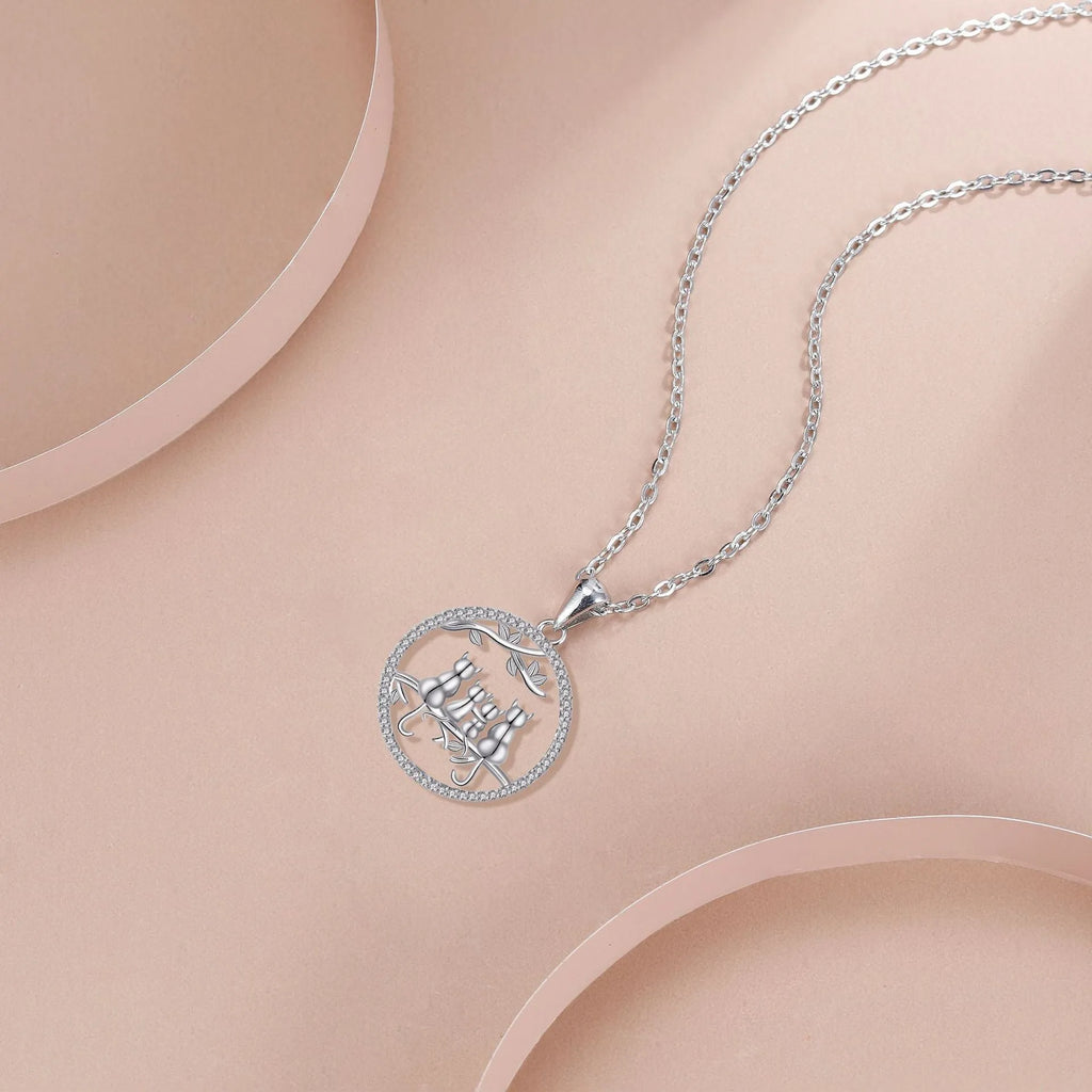 Four kitten necklace with copper electroplated pendant and cross chain style jewellery