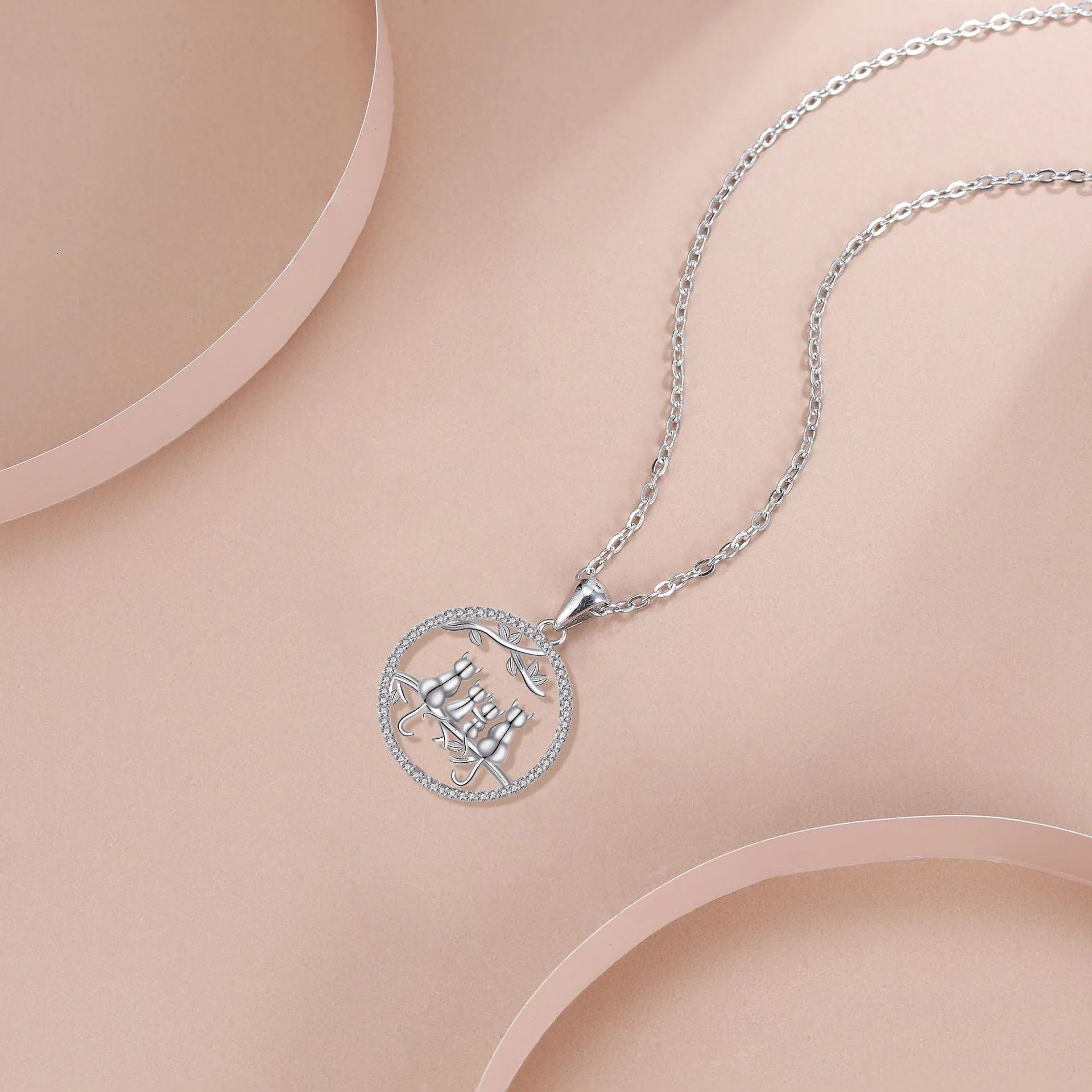 Four kitten necklace with copper electroplated pendant and cross chain style jewellery
