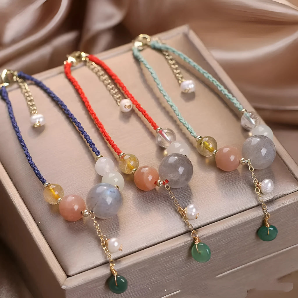 Hand-woven women's bracelet with peace buckle, crystal beads, and sequins in red, green, or blue.