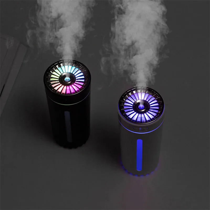Black portable USB humidifier with colourful lights on car dashboard