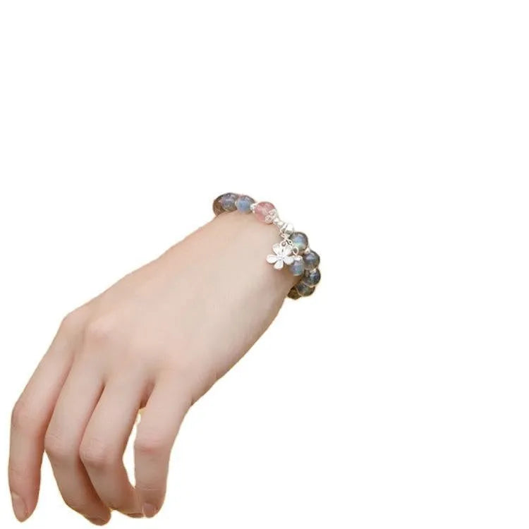 Grey moonlight crystal bracelet with Zodiac design, featuring 7.5mm moonlight lime and strawberry quartz stones on 925 silver.