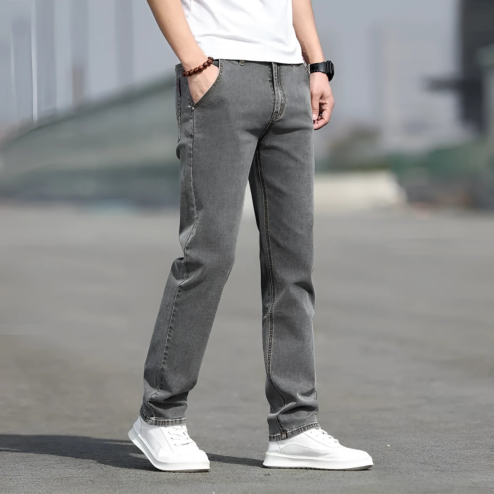 Men's smoky grey straight leg jeans with low waist design and zipper fly closure