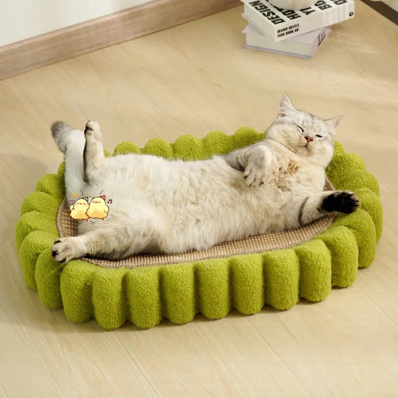Green oval sisal cat scratch pad bowl serving as a cat bed and furniture protector.