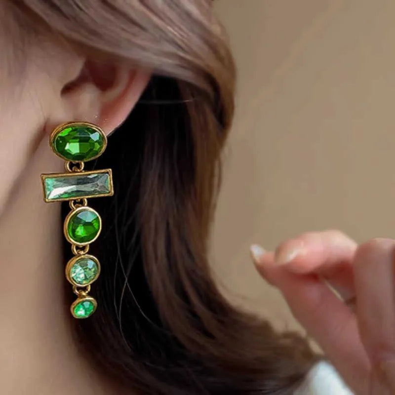 A pair of green gradient geometric drop earrings with alloy tassels and an inlaid zircon stone.