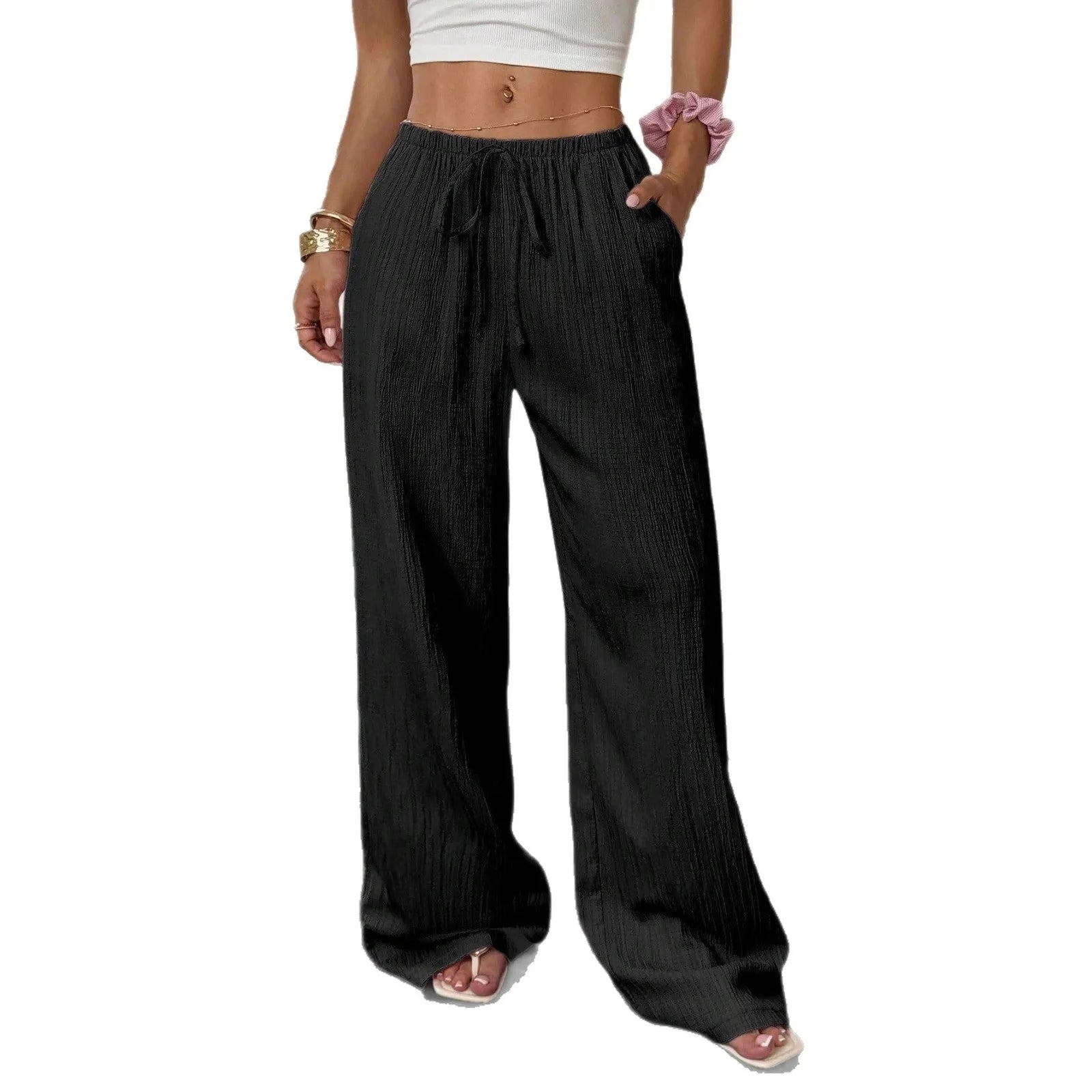 Women's black wide-leg trousers with lace-up waist detail on hanger
