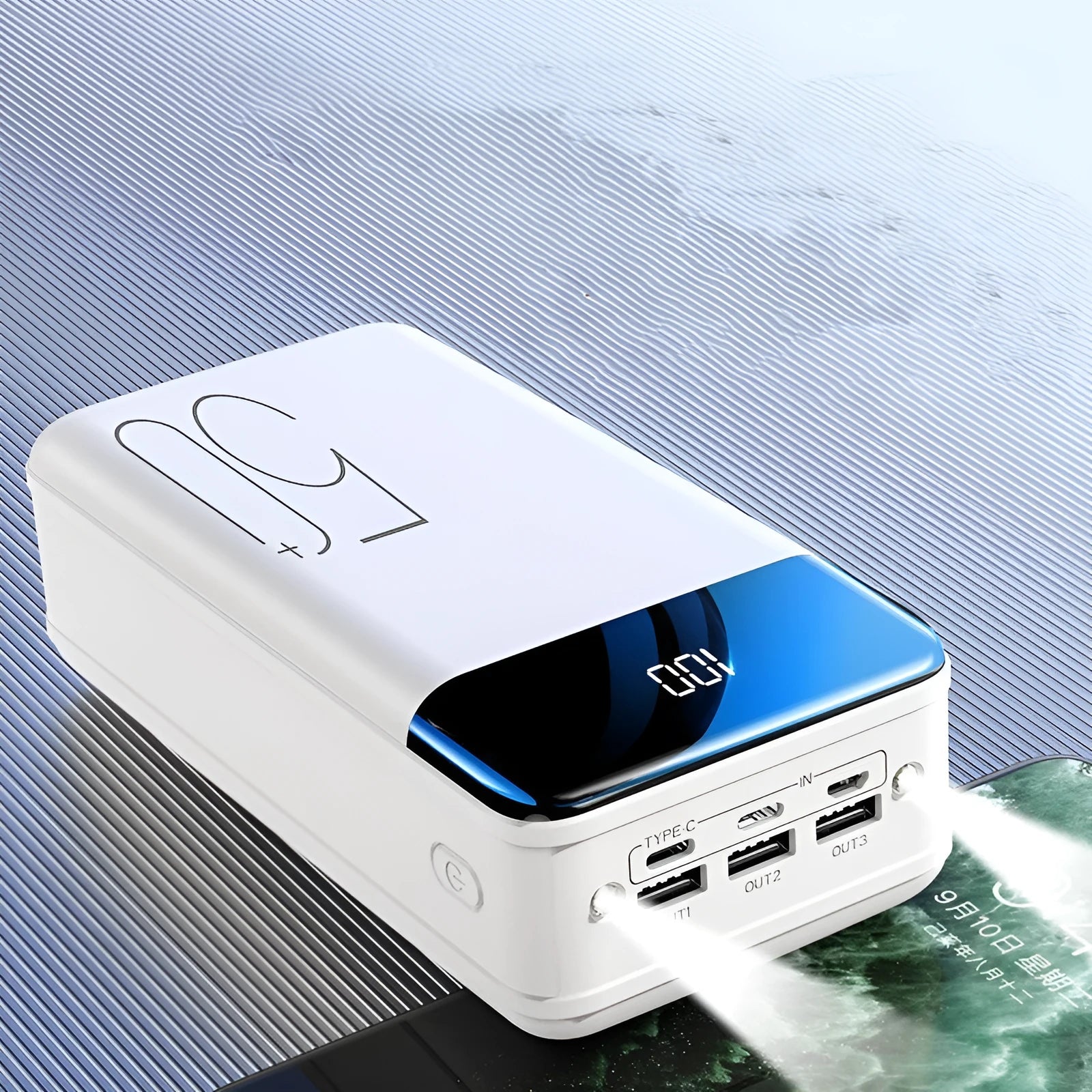 Large 50000mAh capacity power bank with three output ports in black plastic casing