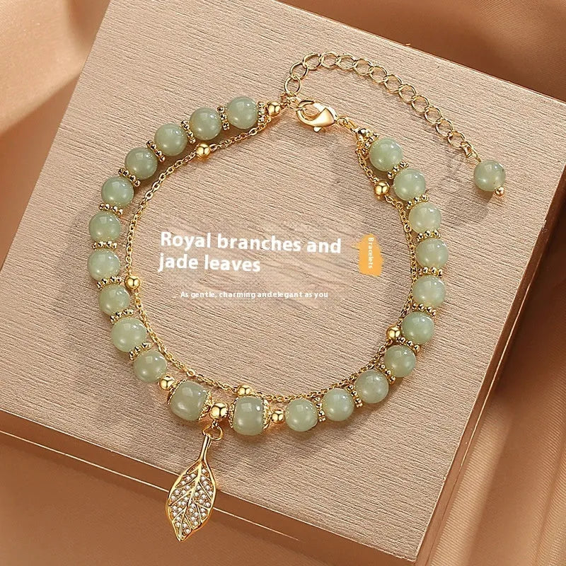 Chinese style glass bamboo leaf bracelet for women with manual craft details.