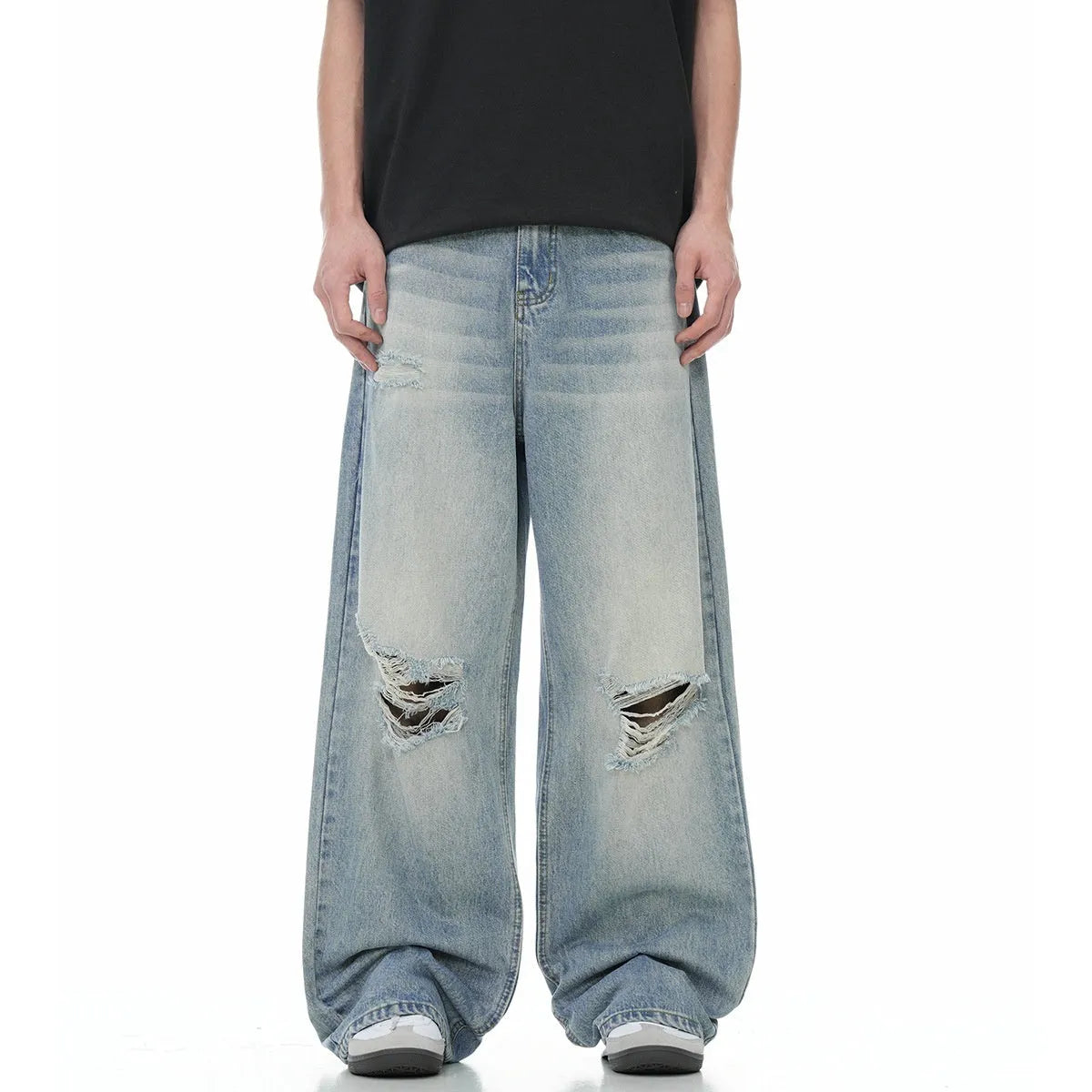 Blue men's straight-leg jeans with ripped details and a zipper fly, showing retro style.