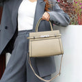 Small square genuine leather shoulder bag in horizontal design with multiple internal compartments