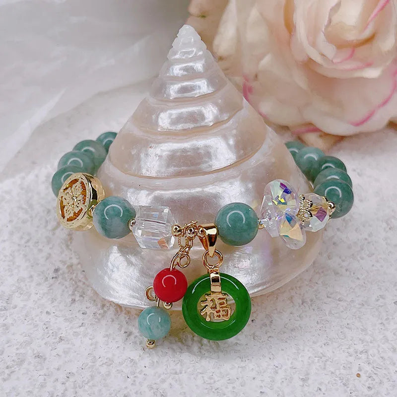 Retro jinsi jade bracelet with fu character blessing card pendant against neutral background