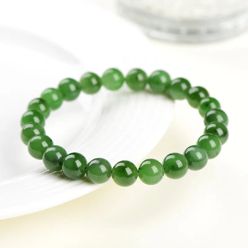 Natural jasper ball bracelet with polished round jade beads on a single strand, showing different bead size options.