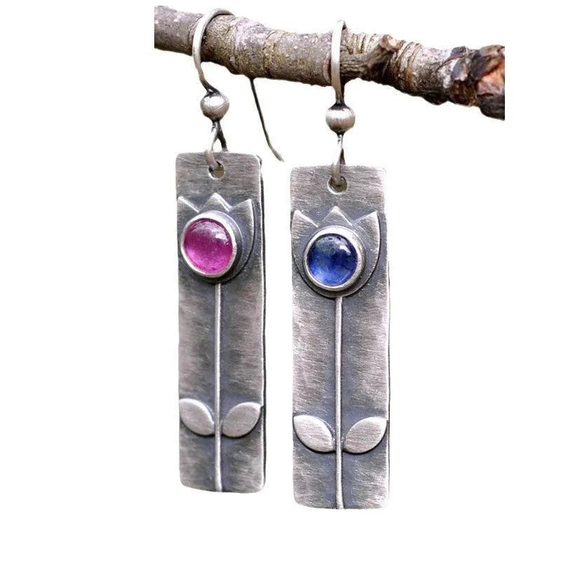 Antique finish red sapphire geometric earrings with elliptical stones and retro styling
