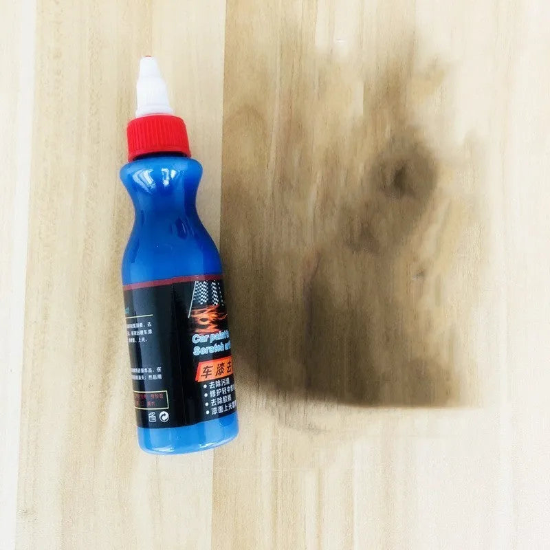 Small blue car scratch repair tool with applicator for automobile surface treatment