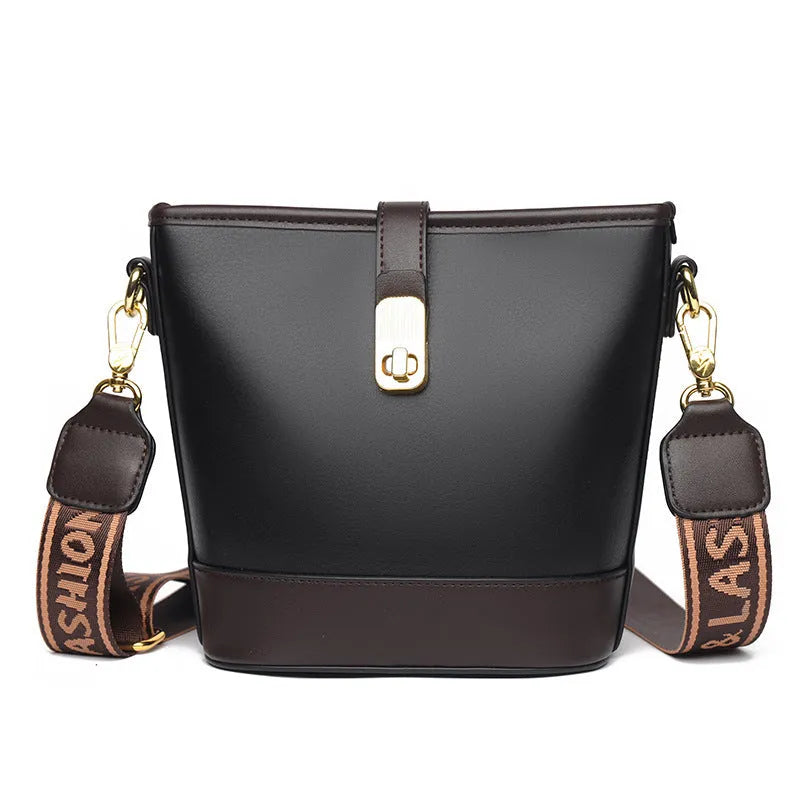 Korean-style black bucket messenger bag showing zipper compartments and adjustable shoulder straps