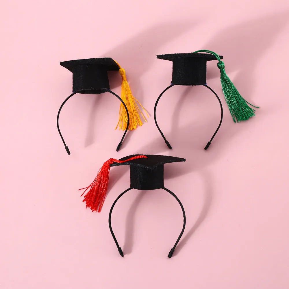 Yellow doctor's degree felt hair band and bow tie set on a small dog