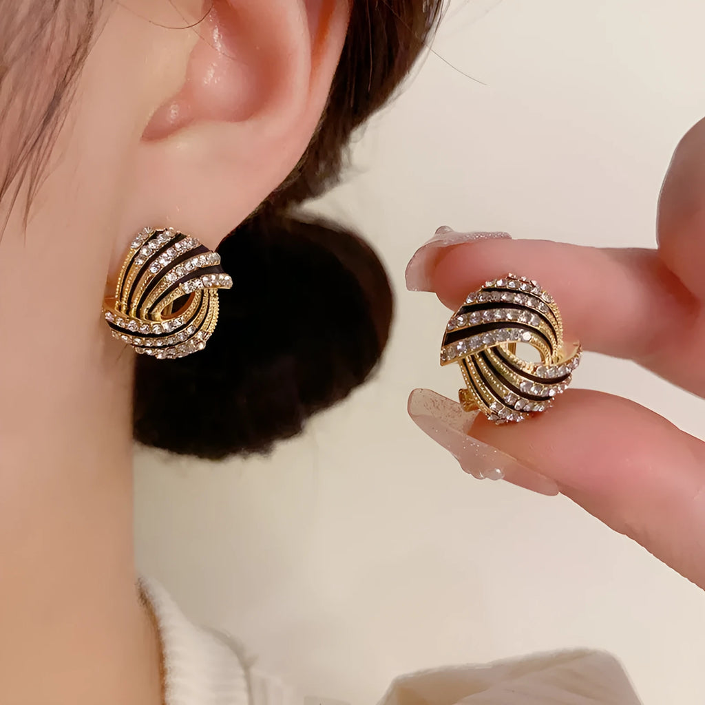 Super-flashing rhinestone ear studs with thick real gold plating on copper in a geometric ring style