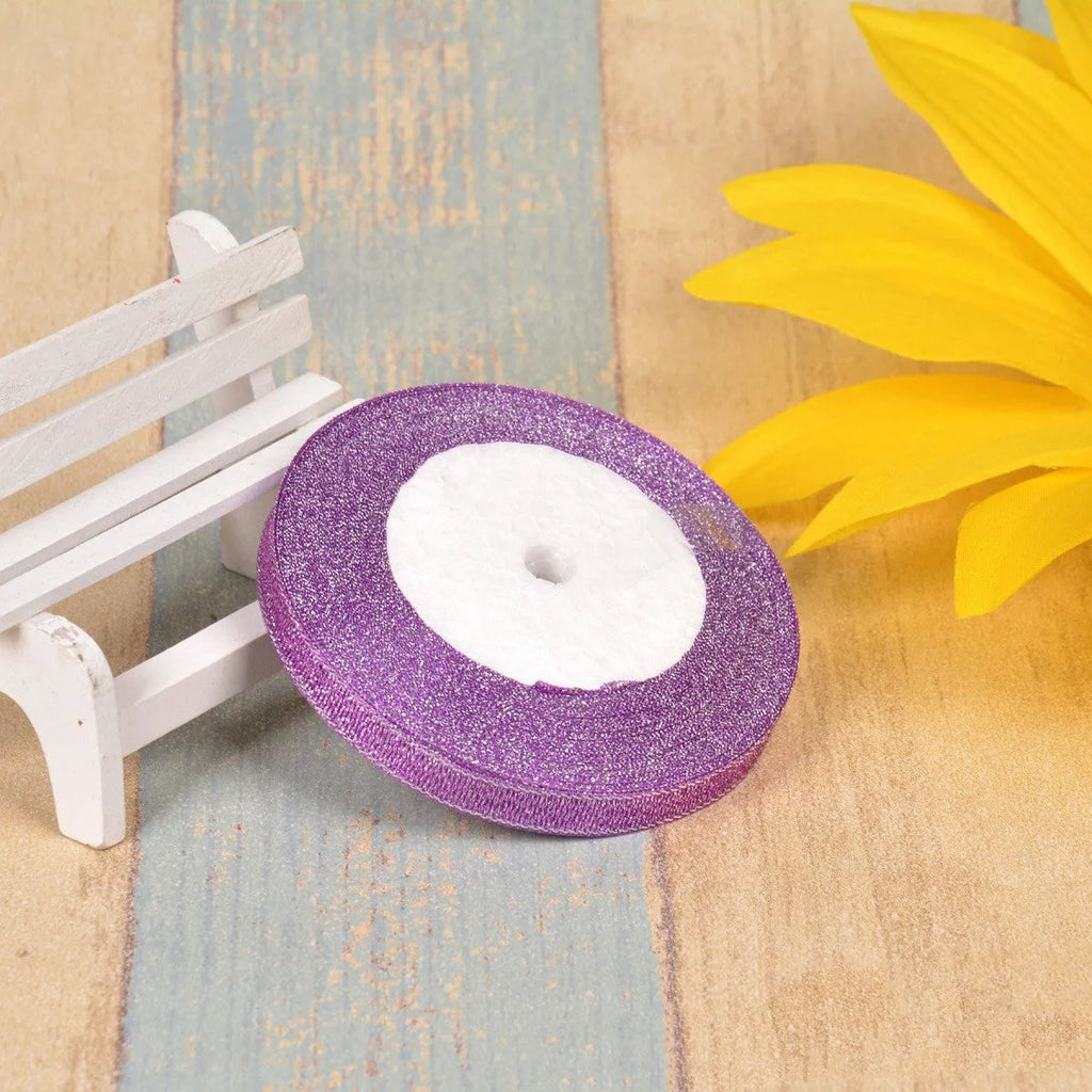 Green onion coloured polyester ribbon with gold and silver wire patterns on 25-yard roll