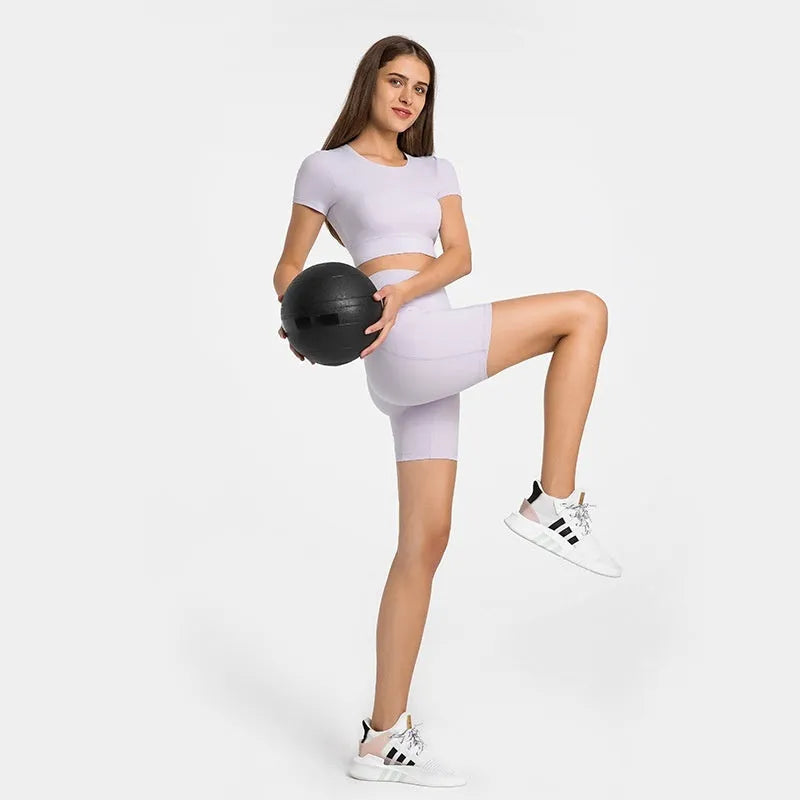 Women's short-length sports shorts in cotton blend fabric shown in black, for running and fitness activities.
