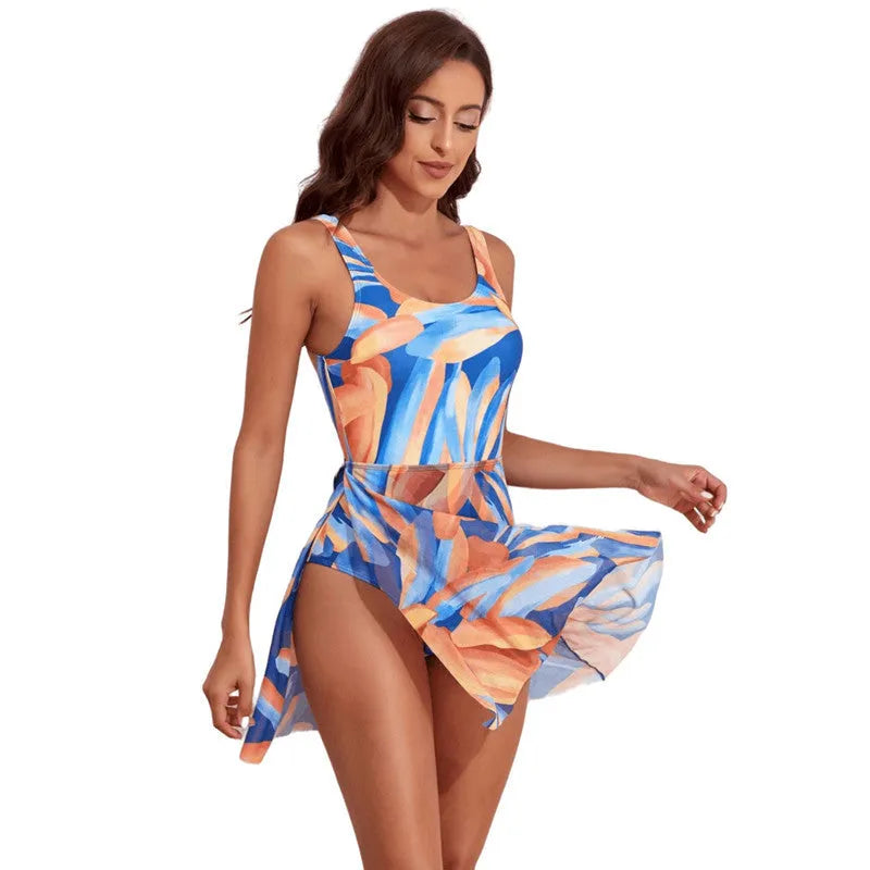 Women's single-shoulder one-piece swimsuit with colourful digital floral print and slim waist.
