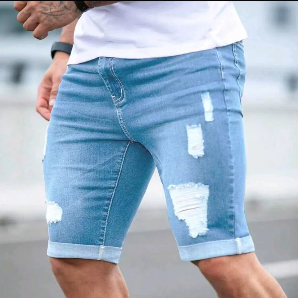 Sky blue men's denim shorts with a multi-hole design and low waist.