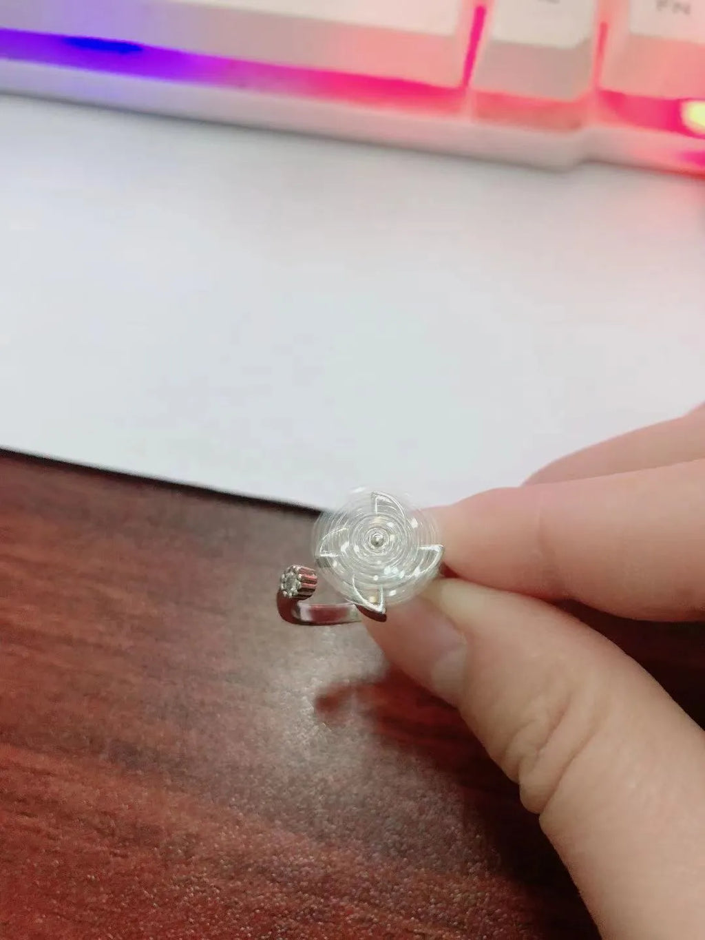 Gold and silver rotating windmill ring with geometric design