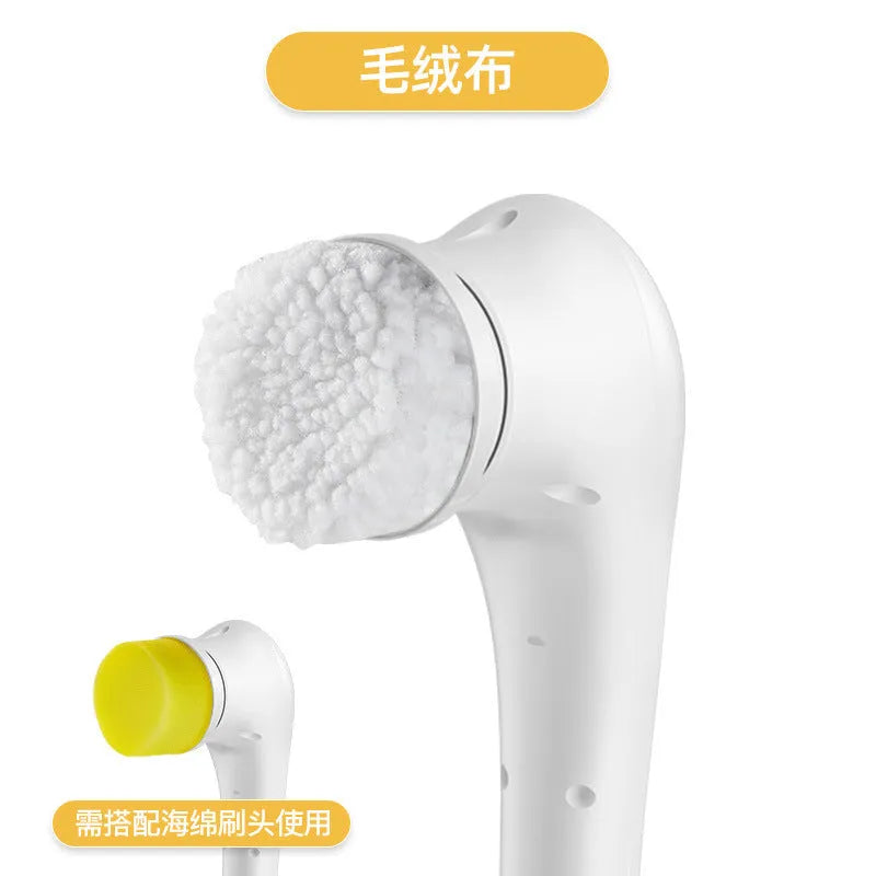 White cordless electric scrubber with five interchangeable brush heads on a kitchen counter