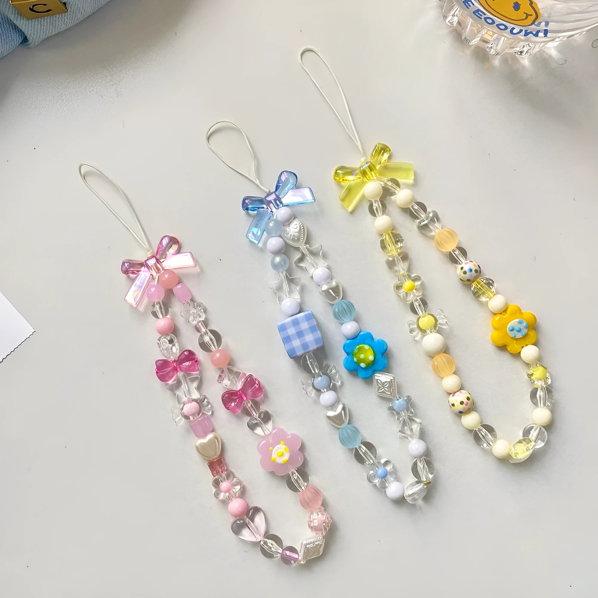 Colourful beaded flower phone lanyard with adjustable rope cord in blue, pink or yellow option