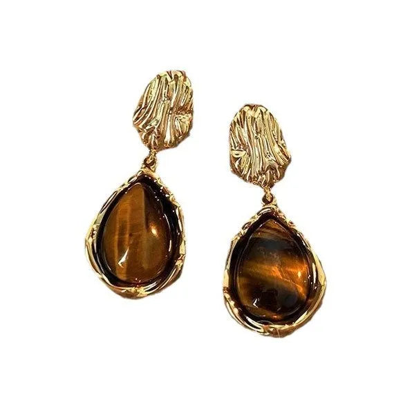 Handmade geometric holiday ear ring set showing three styles with tassel elements in different designs